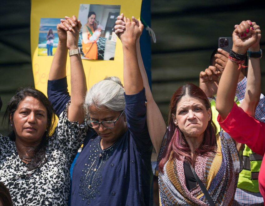 Community members promise to seek justice for Mamta Kafle Bhatt at a vigil Saturday, Aug. 24, 2024 in Manassas Park.