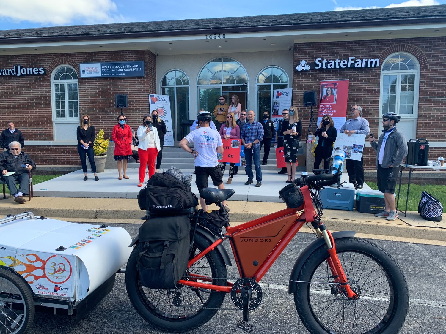 Caring Senior Service founder Jeff Salter rolls up to Caring Senior Service's Northern Virginia office in Gainesville, promoting the company's 'Grab the Bars' fundraising campaign.