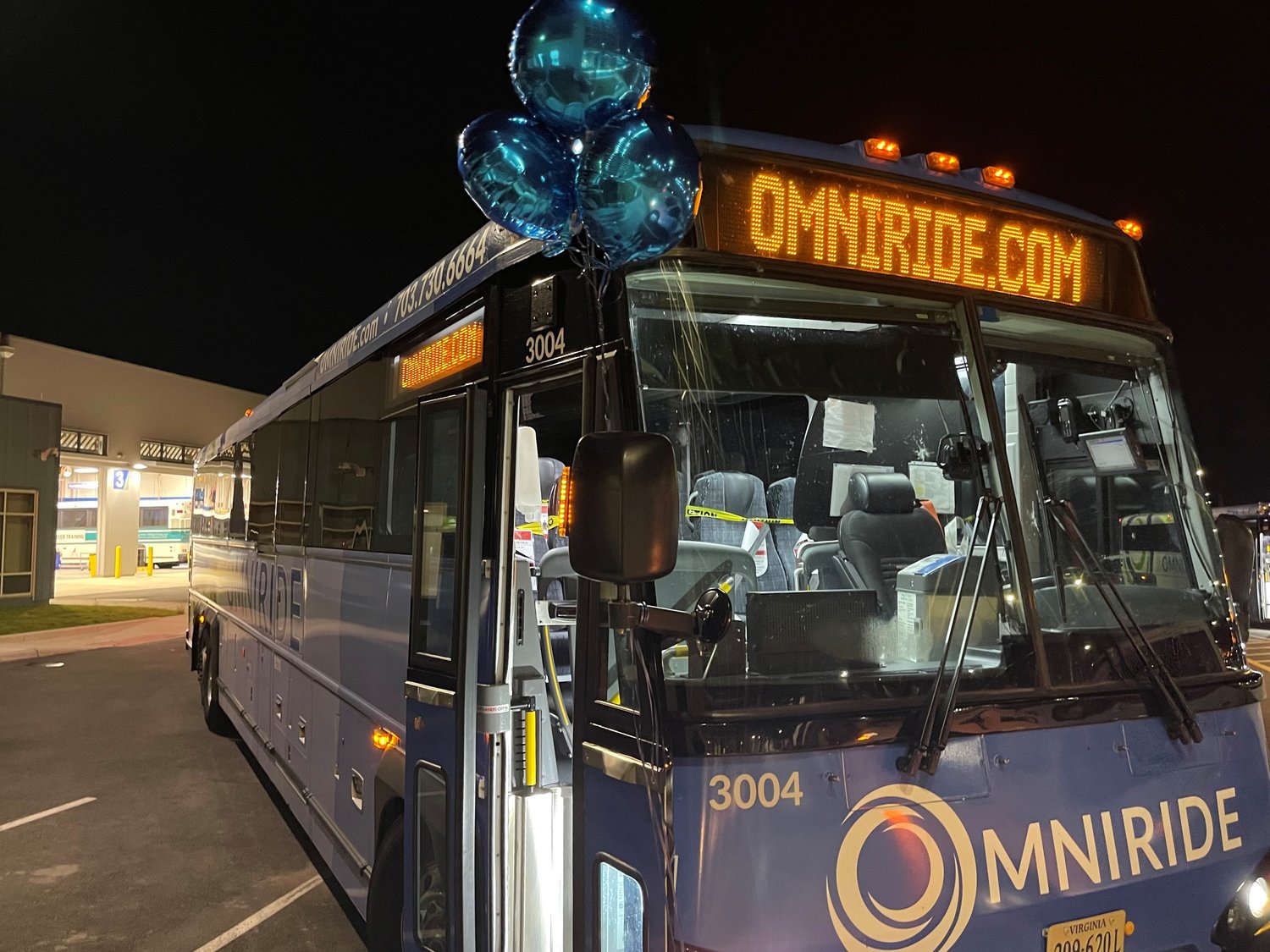 PRTC staff celebrate the inaugural launch of buses from their new western location in Manassas.