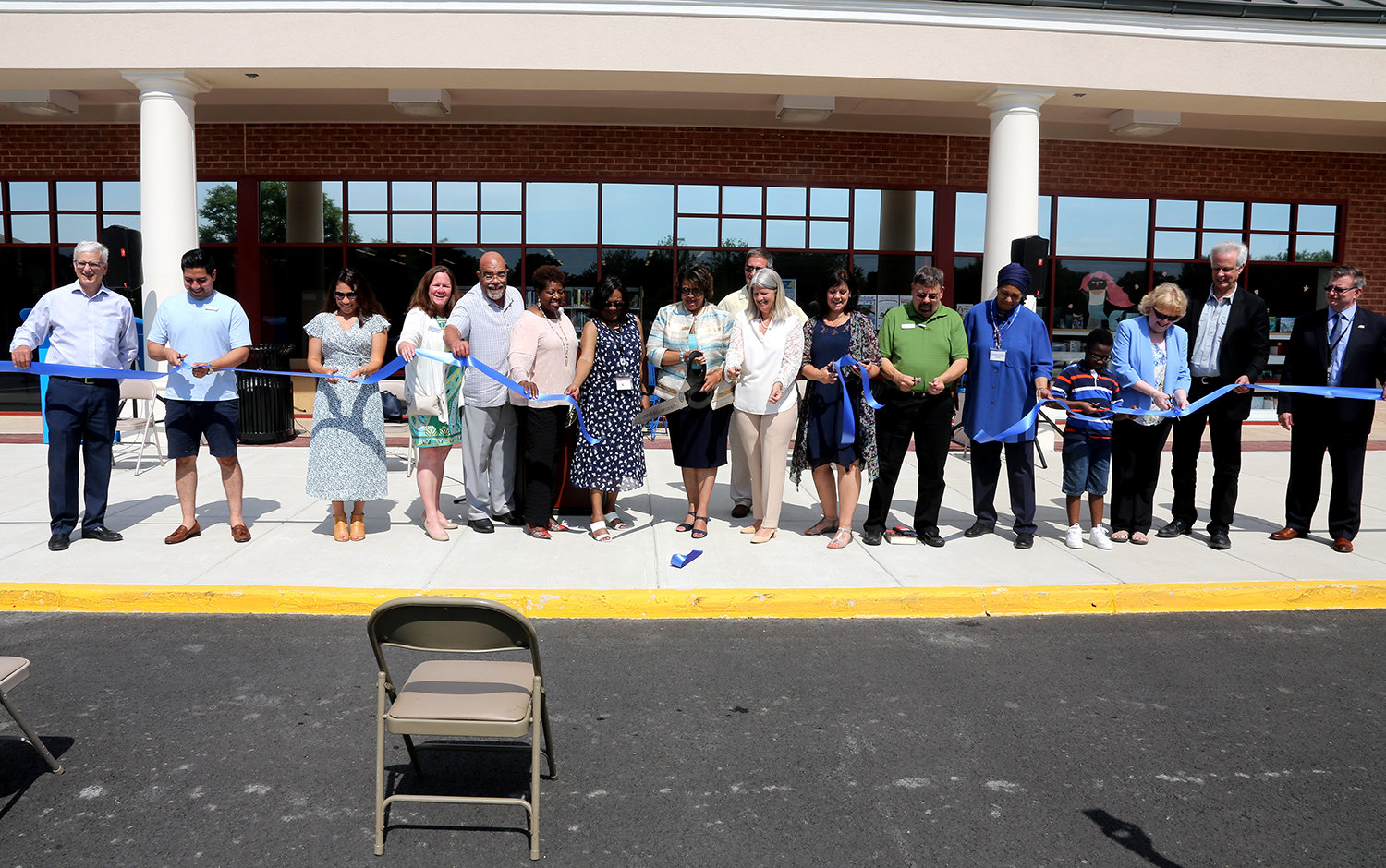 Officials from the City of Manassas and Prince William County celebrate the opening of the new local library.