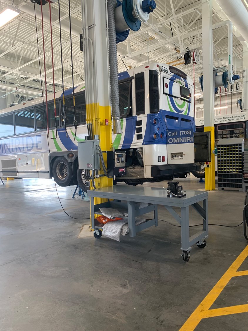 Bus being serviced inside new facility