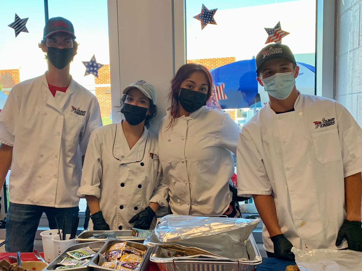 Patriot HS culinary students were excited to get back into the kitchen after a virtual year. They provided dinner to the VIP guests while other attendees got a "Taste of Bristow" from several local restaurants.
