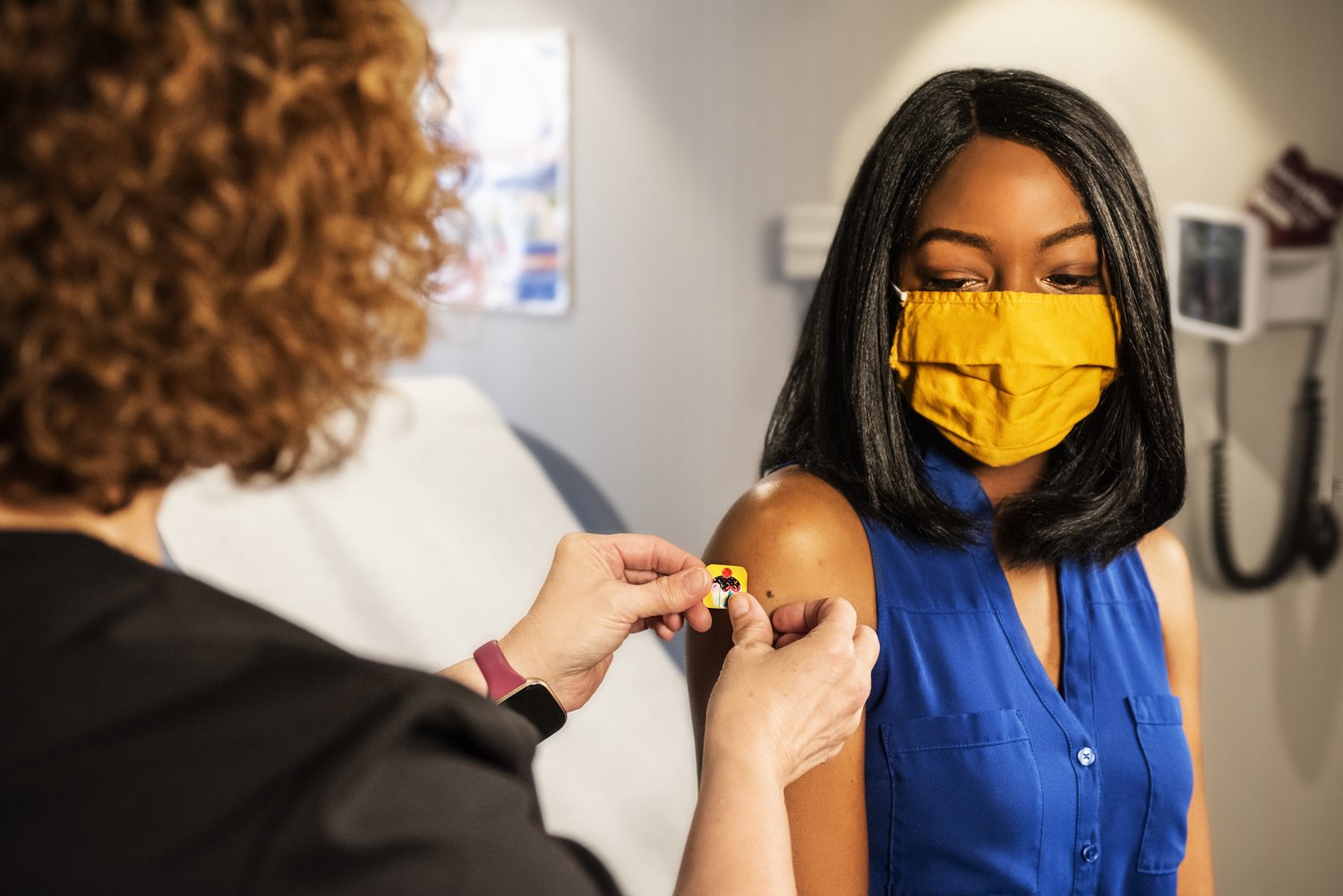 Young woman gets a COVID-19 vaccine shot.
