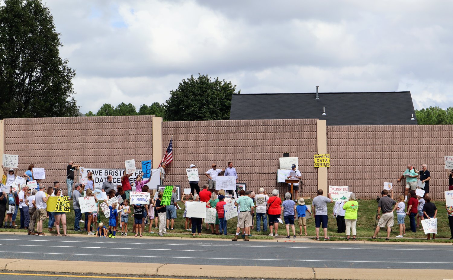 More than 100 protesters of the Bristow data centers hold signs along Linton Hall Road.