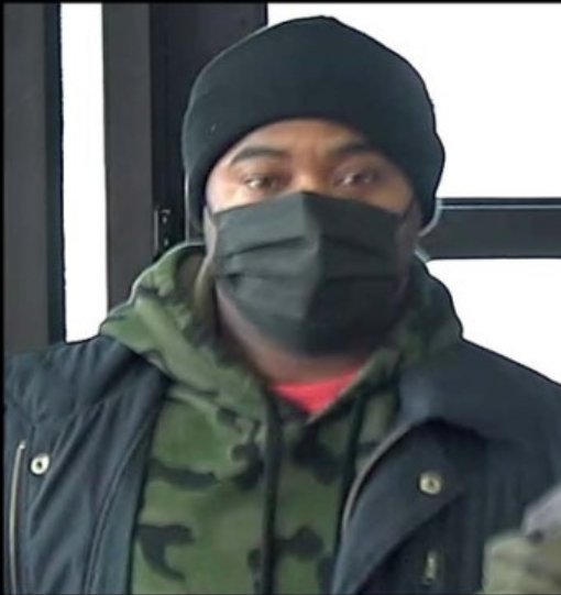 A surveillance camera captures an image of a man robbing the Manassas Bank of America.