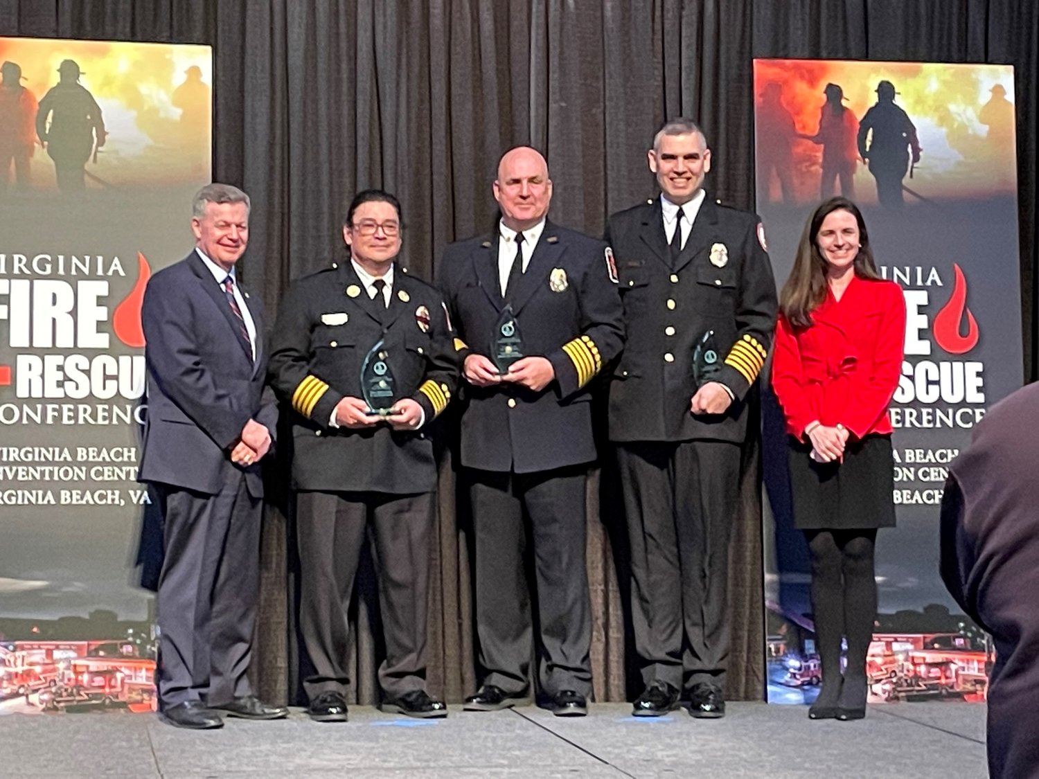 Accepting Outstanding Fire Department Response Award (left to right)

Bob Mosier, Secretary of Public Safety and Homeland Security

Assistant Chief Ernest DeSantis (Occoquan-Woodbridge-Lorton VFD)

Acting Chief James Forgo (Prince William County Fire & Rescue System)

David Glinski, President (Dumfries-Triangle VFD)

Maggie Cleary, Deputy Secretary of Public Safety and Homeland Security
