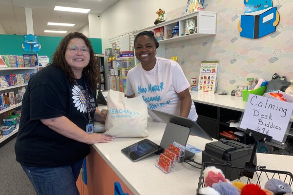 One of the Teachables Best Educators of 2022 Heather Ball, a 1st Grade teacher at Cedar Run Elementary in Bristow, is excited to receive her gift bag from Teachables owner Jennifer Powell.