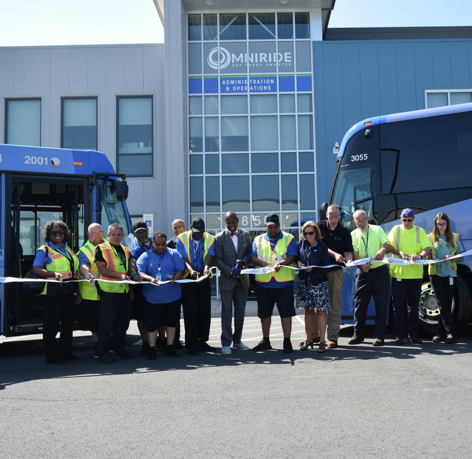 (L-R) PRTC Board Chair Victor Angry, NVTC Executive Director Kate Mattice, OmniRide Executive Director Bob Schneider, and bus operators and mechanics.