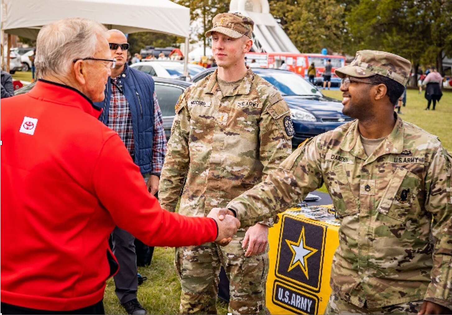 Redskin's Coach Coach Joe Gibbs meets members of the U.S. Army.