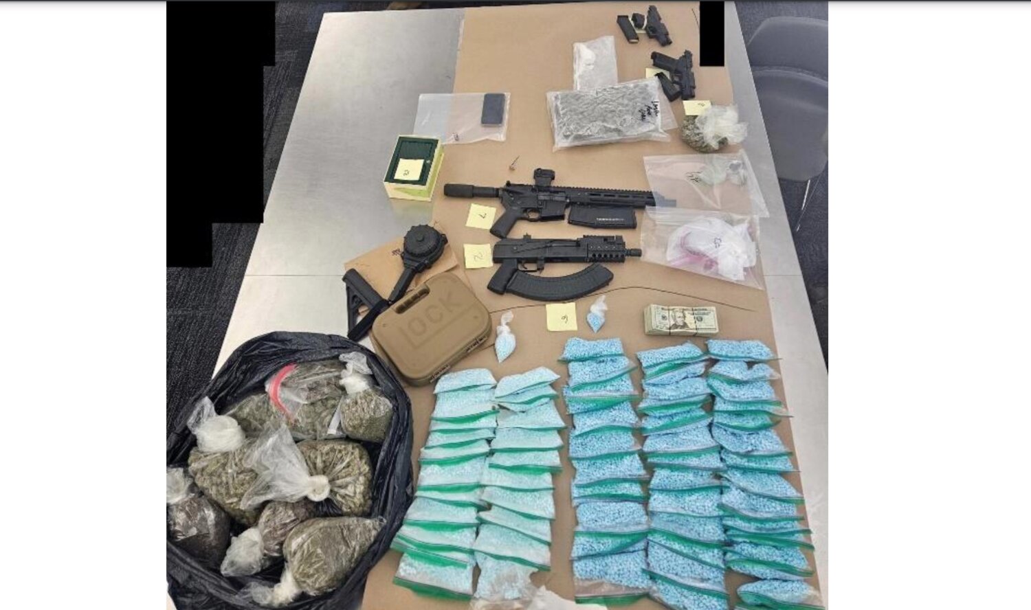 Drugs and weapons seized.