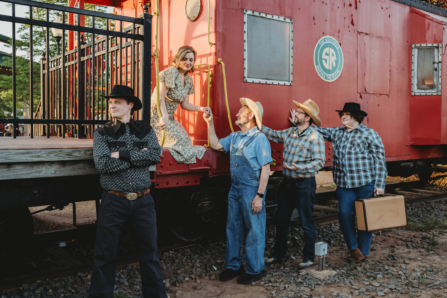 In this scene from '110 in the Shade,' performed by the cast of Prince William Little Theatre in Old Town Manassas, Lizzie arrives by train to find her father and brothers awaiting her arrival, as well as the town sheriff.