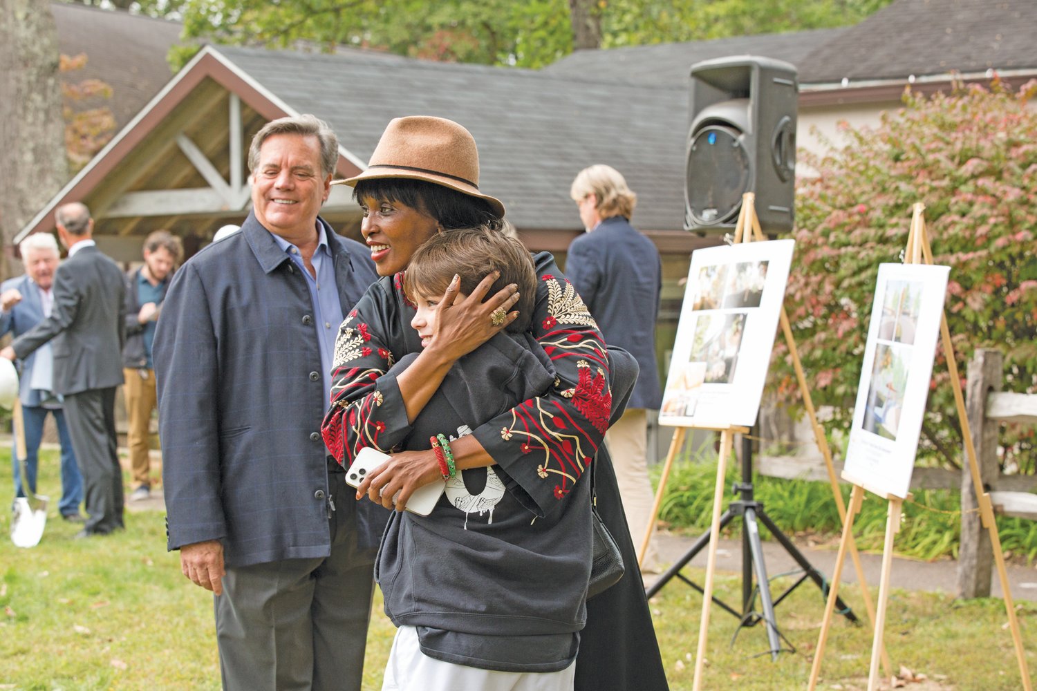 Buckingham Friends School parent Leila Yusuf gives student Zack Schmukler a hug during the groundbreaking ceremony for a multi-million dollar expansion project on the school’s 44-acre campus in Lahaska.