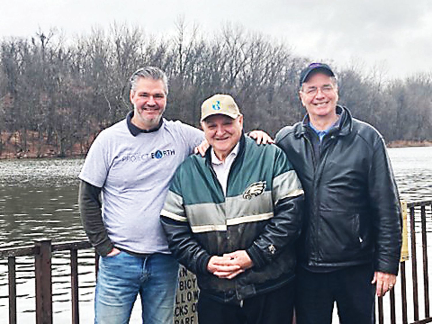 From left are Robert Catalano, Joe Abate and Dave Babula near the Delaware River in Burlington City, with Burlington Island in the background.