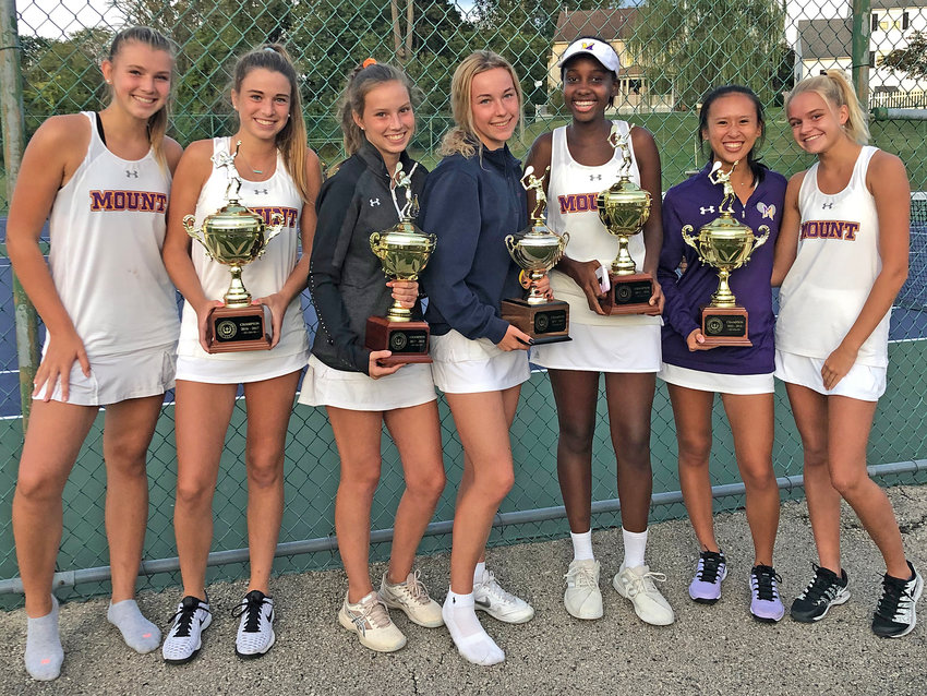 Mount St. Joseph's varsity tennis players are pictured celebrating their 2019 league championship.