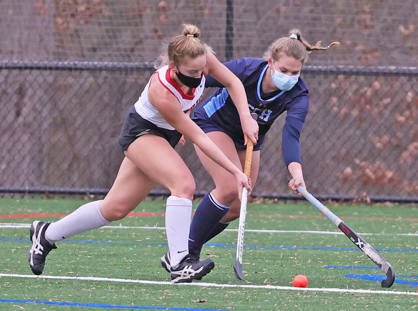 Germantown Academy's Sophie Towne (left) is marked by fellow senior Ainsley Rexford of Springside Chestnut Hill.  (Photo by Tom Utescher)