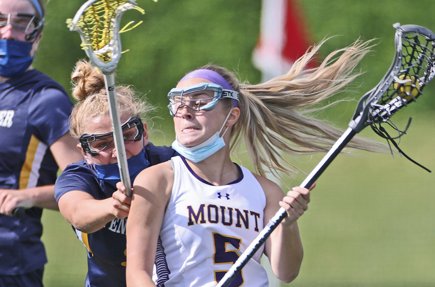 Mount St. Joseph's Devon McGarvey (with ball) finds herself closely marked by a fellow senior, Maggie Turner of Penn Charter.&nbsp; (Photo by Tom Utescher)