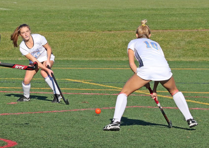 From the right side of the circle, Hannah Pierce (left) centers the ball to fellow senior Bella Tulio, who would drive it home for the Blue Devils' second goal.