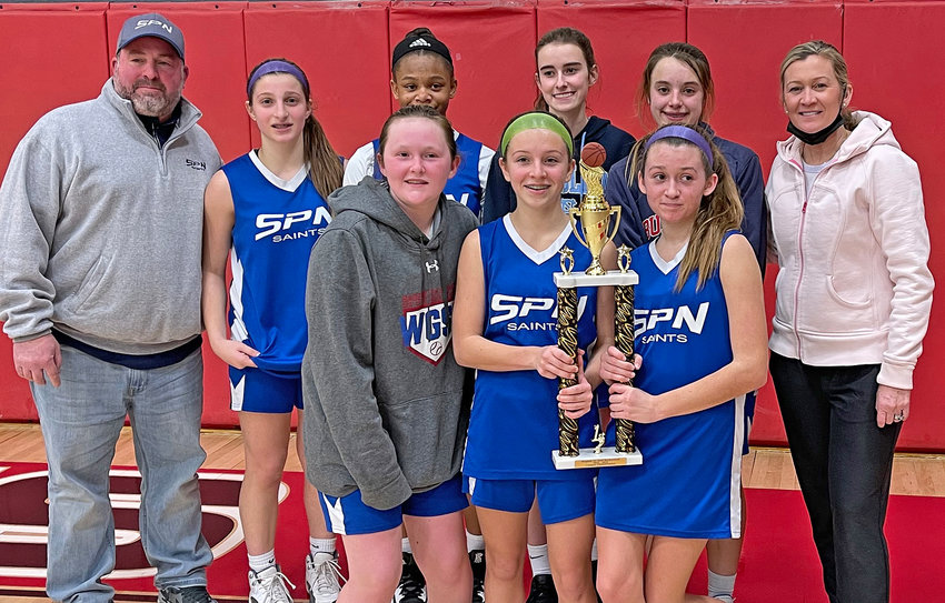 Last Saturday night, the St. Philip Neri girls won the CYO championship in Montgomery County's Region 21, defeating Visitation BVM of Trooper, Pa. by a score of 34-26. Gathered around their trophy after the game are  (front row, from left) Olivia Bragg, Sophia Nagle, and Katie Shoup, and (back row) Coach Bob DiBenedetto, Mia DiBenedetto, Morgan Cross, Maddie Menix, Kiera Whalen, and Coach Kristin Shoup.  (Photo by Tom Utescher)