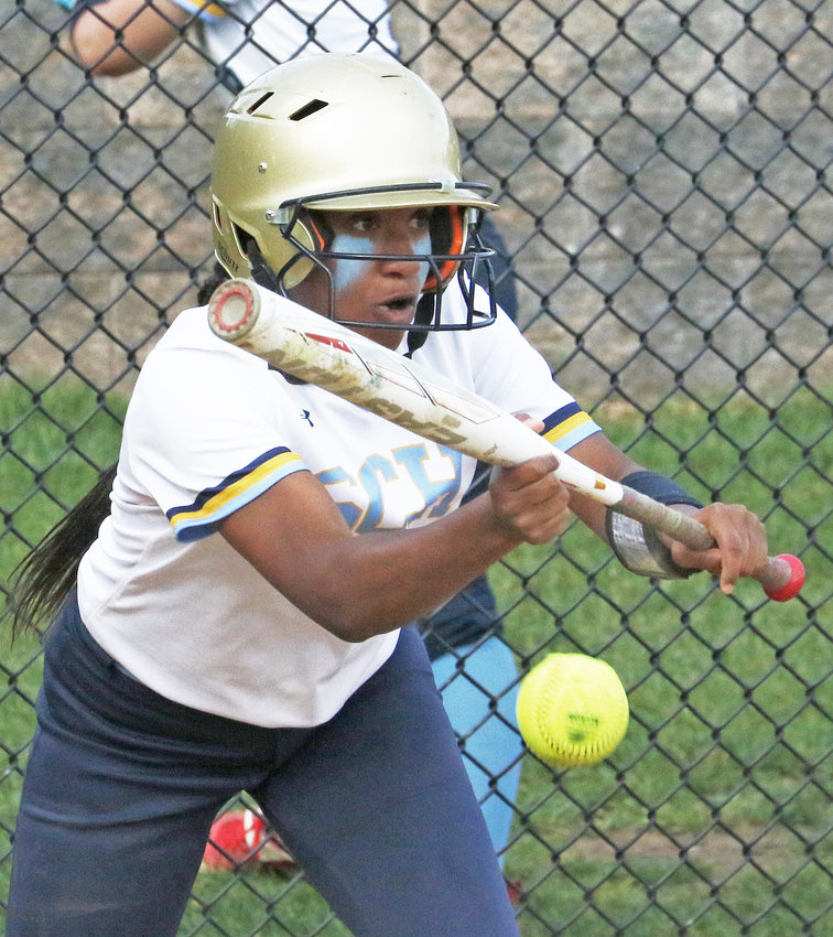 Junior Courtney Oliver lays down a bunt for the Blue Devils.&nbsp; Photo by Tom Utescher