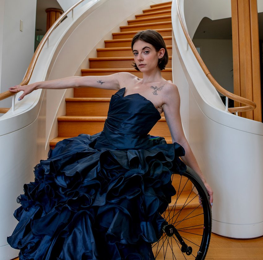 Model and disability advocate Bri Scalesse, wearing a gown by Oscar de la Renta, models for The Vault by Flourtown-based designer Nancy Volpe Beringer.