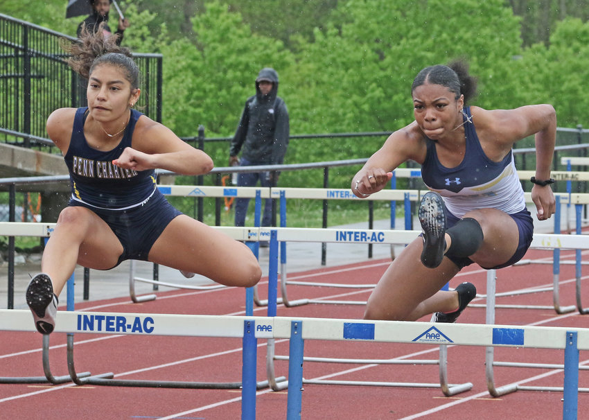 Penn Charter's Amanda Ehrenhalt (left) and SCH's Jasmine Matthews duel in the 100-meter hurdles.&nbsp; Photo by Tom Utescher