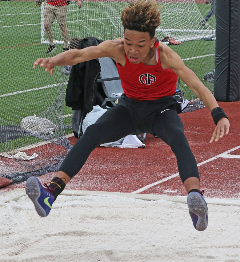 In the long jump, GA sophomore Blake Brown is cleared for landing.&nbsp; Photo by Tom Utescher