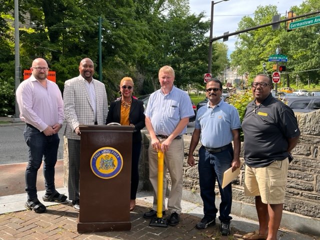 Councilmember Cindy Bass hosted a Cresheim Valley Drive reopening ceremony to celebrate the completion of six months of construction on Fri. June 3. Joining her were (from left to right) John DiGiulio, community relations manager with the Philadelphia Water Department; PWD Commissioner Randy E. Hayman; Bass; Philadelphia Streets Department Chief Highway Engineer Steve Lorenz; PWD Engineer Shyam Thomas and C. Abbonizio, Construction Project Manager.
