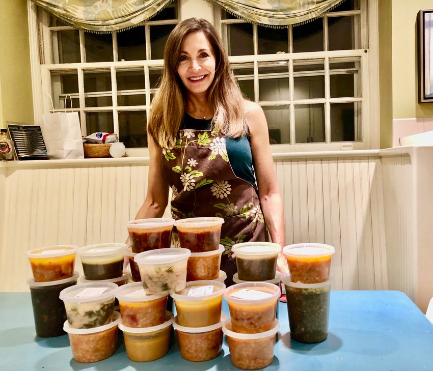 West Mt. Airy attorney and foodie Debra Wolf Goldstein with homemade soups given to a local nonprofit that feeds residents who are homebound or have a disability.