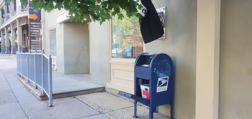 Mailbox in front of the Germantown Avenue post office in Chestnut Hill found opened and unlocked on July 19. Photo by Kristin Holmes