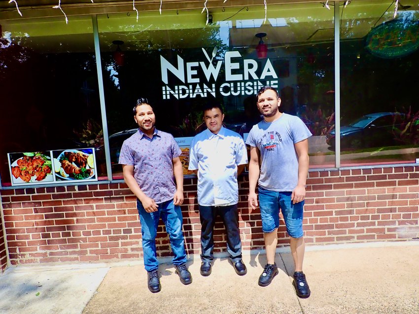 Hemant Sen Oli (left), owner of New Era Indian Cuisine at 219 E. Willow Grove Ave. in Chestnut Hill, is flanked by his friends/cousins/chefs, Dhan Khadka (center) and Arjun Thapa. All three are from Nepal.