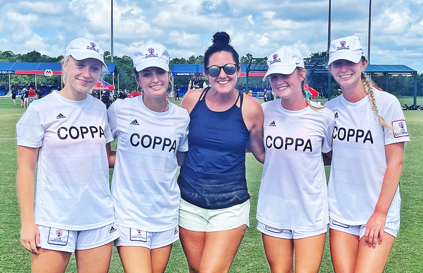 After the PSC Coppa Rage won the U-17 national championship, the four players from Springside Chestnut Hill Academy posed with their school coach, Maria Kosmin. From left to right are Brigid McDonald, Bella Brown, Coach Kosmin, Elena Franklin, and Abby Fitzmaurice.