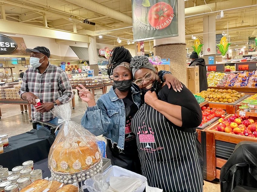 Mercer (right) with her baked goods at a pop-up event at the Brown's ShopRite supermarket in Roxborough with her niece, Ryshawna Fisher. Mercer&rsquo;s husband, Lyman, is on the left.
