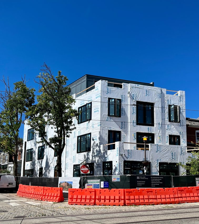 A building at 8100 Germantown Ave., now under construction, is being marketed to the same kind of resident who bought at One West, the condo complex several blocks north.