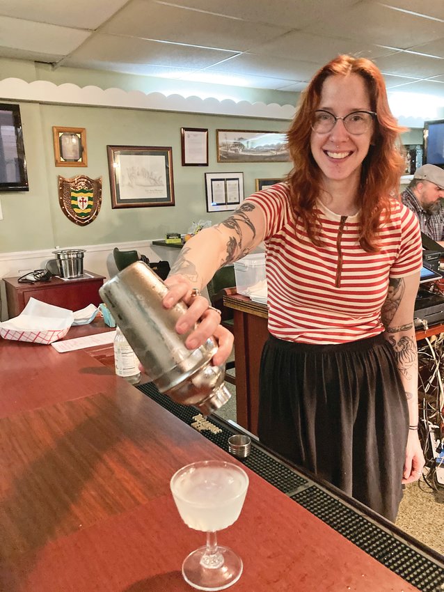 Liz Schlatter, who went from a career in science to a career behind the bar, is teaching upcoming classes in cocktail creation for Mt. Airy Learning Tree.