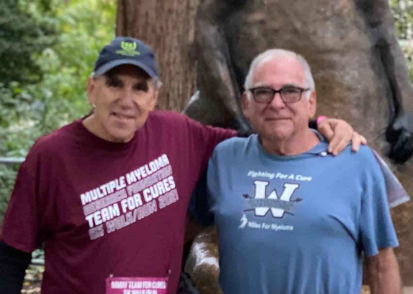 Joel Gottfried (left) and Richard Abraham, of the Wyndmoor Warriors, are seen in October of 2021 at the annual fundraising 5K run to raise funds for the Multiple Myeloma Research Foundation.