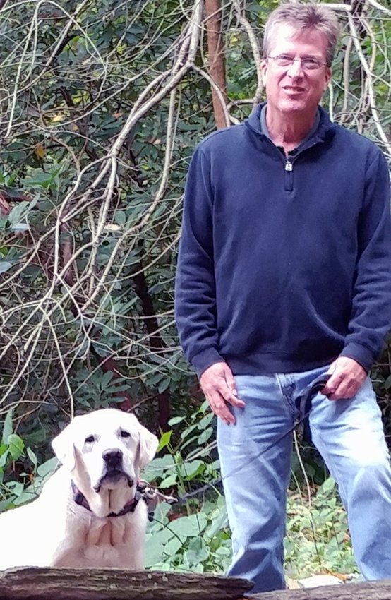 Bill Markloff with Josie, his beloved Labrador Retriever, on Forbidden Drive near Valley Green Inn.