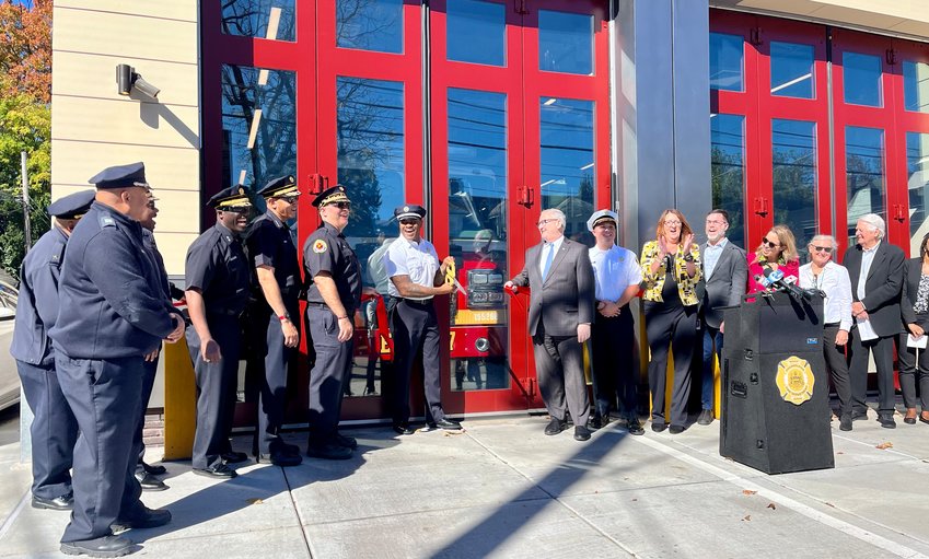 In the center holding the scissors is Engine 37 Capt. Ray Saunders. On the right side is Mayor Kenney, PFD Deputy Chief Anthony Bompadre and Department of Public Property Commissioner Bridget Collins-Greenwald (clapping). On the left side is Fire Commissioner Adam K. Thiel, First Deputy Commissioner Craig Murphy, and Deputy Commissioner Anthony Hudgins.