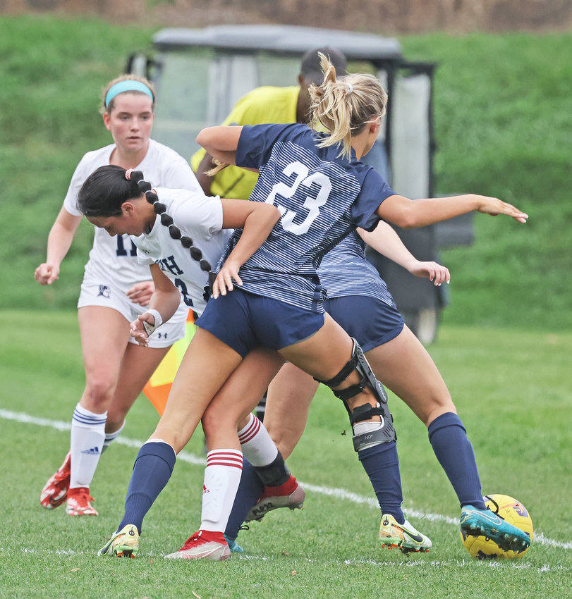 In a scrum along the sideline, SCH senior Lisa McIntyre (left) gets tangled up with Episcopal's Caitlin McCarthy. In the background at left is Blue Devils senior Julia Thomson.