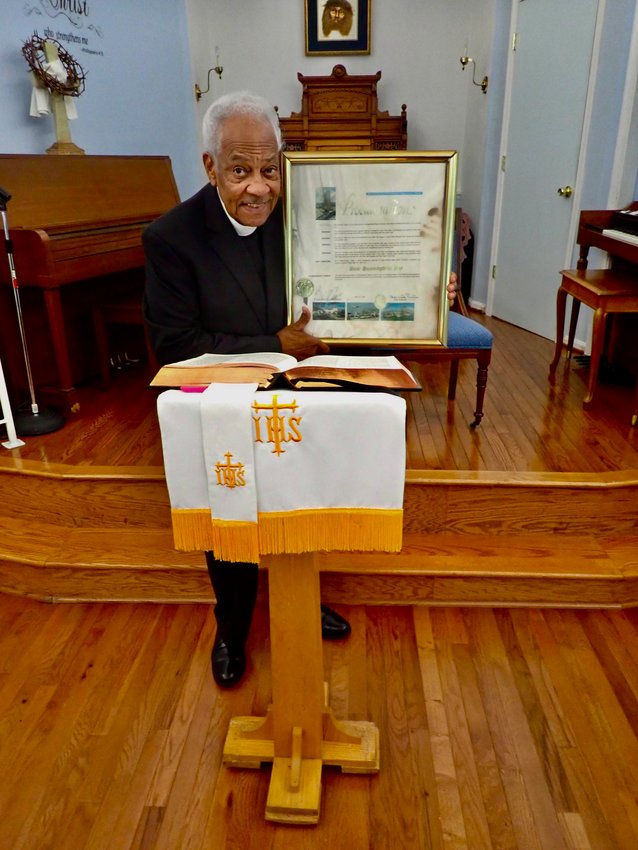 The Rev. Joe Williams, pastor of Mt. Airy United Fellowship Church, which he founded seven years ago at 701 W. Johnson St., holds the &ldquo;miracle plaque&rdquo; from 1997 that was recently left at the back door of his church.