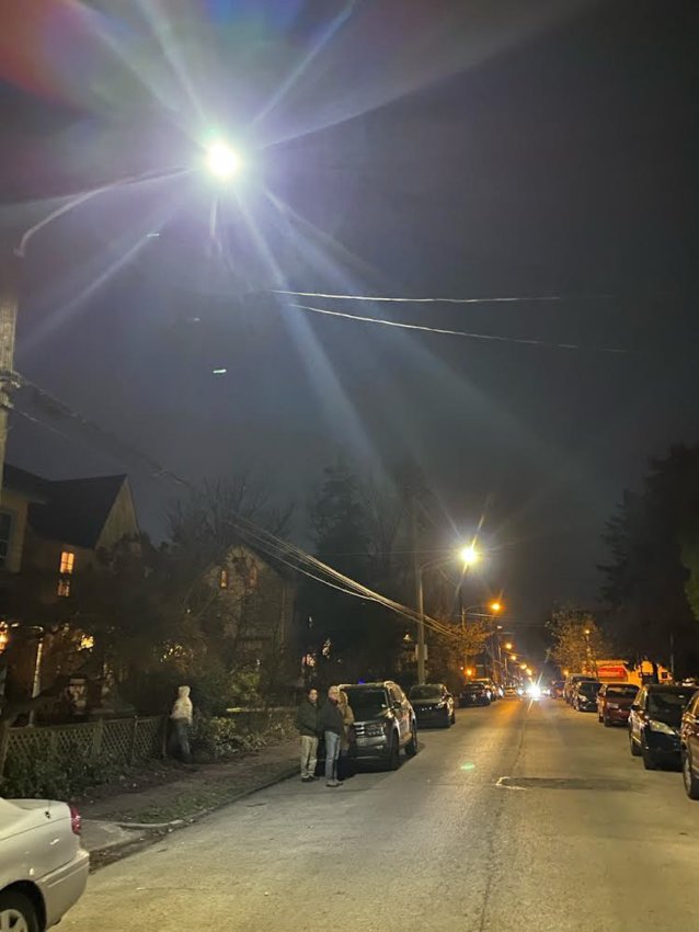 Trial LED streetlights on the 100 block of W. Queen Lane in Germantown on Monday night. The brightest, on the left, is 4000K, while the one next to it is 3000K. The yellowish lights in the background are the existing high pressure sodium light fixtures, which measure about 2700K.
