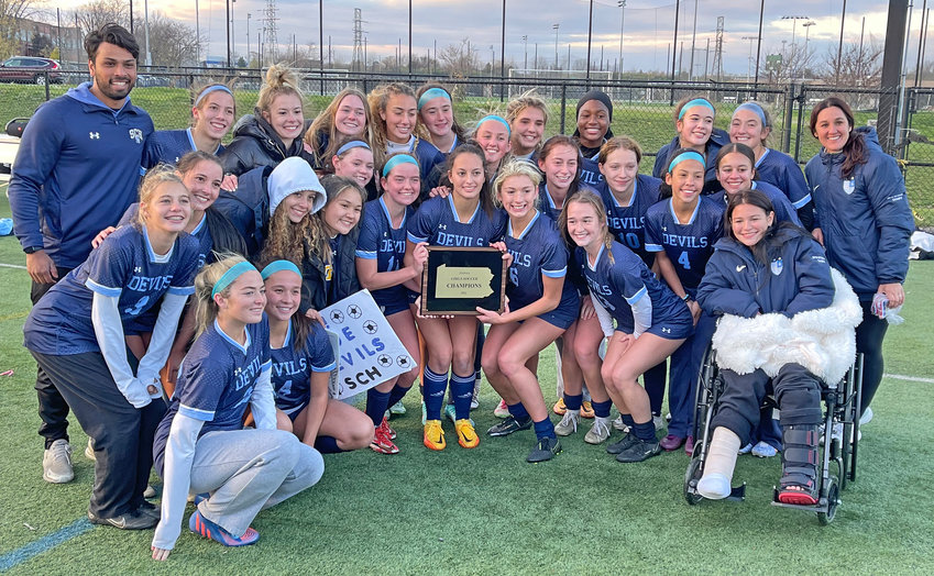 The Blue Devils pose with the 2022 PAISAA championship plaque after winning Wednesday's final.