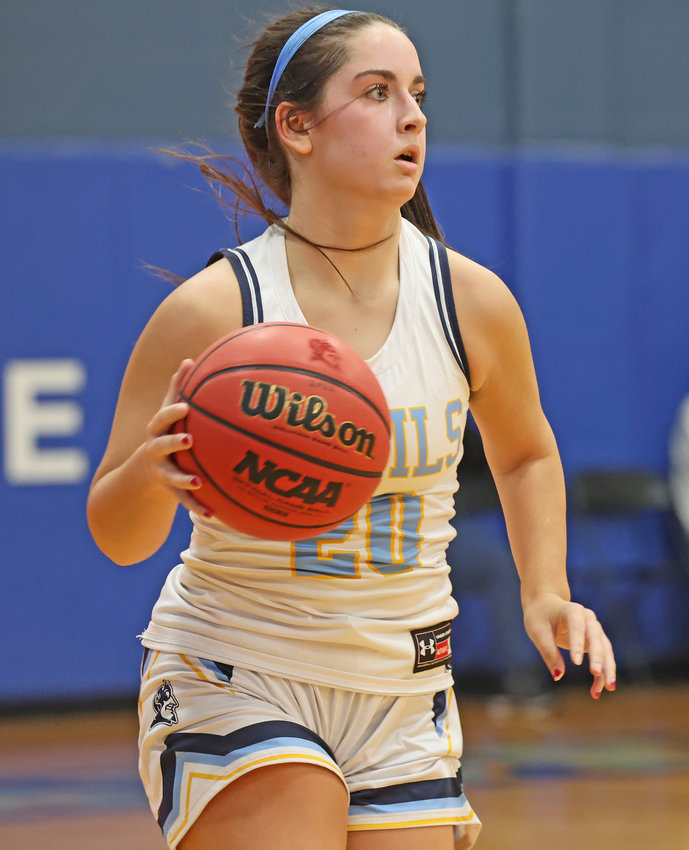 Junior Katelyn Jaconetti brings the ball up the court for the Blue Devils.