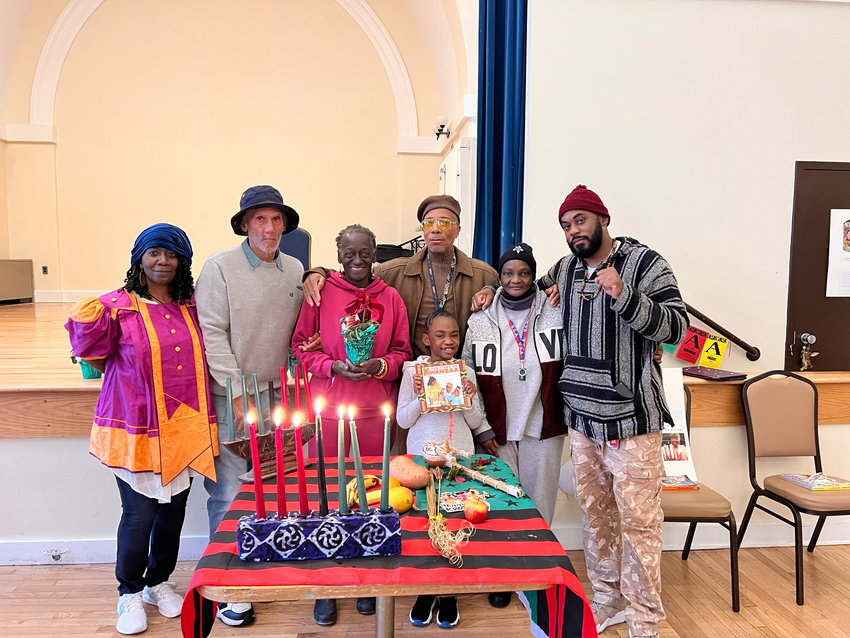 Celebrants at the Aging People in Prison Human Rights Campaign&rsquo;s Kwanzaa observance, prepare for the holiday at Center in the Park in Germantown.