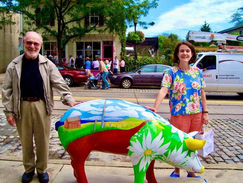 Donald Rackin with his daughter, Rebecca, a Mt. Airy artist who created this pig, Daisy, seen in front of Bredenbeck&rsquo;s Bakery in September 2006.
