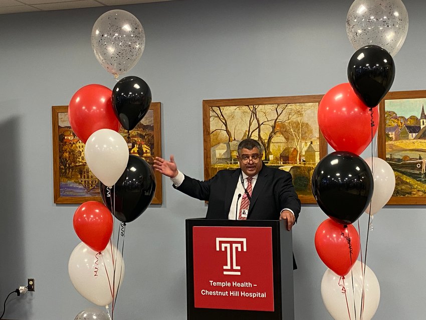John Cacciamani, President and CEO of Chestnut Hill Hospital, celebrates its purchase by a Temple-led consortium.