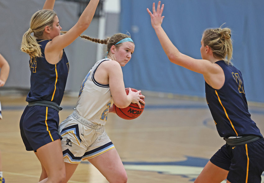 Blue Devils senior Faith Scally (with ball) looks for a way to avoid a Notre Dame double-team.