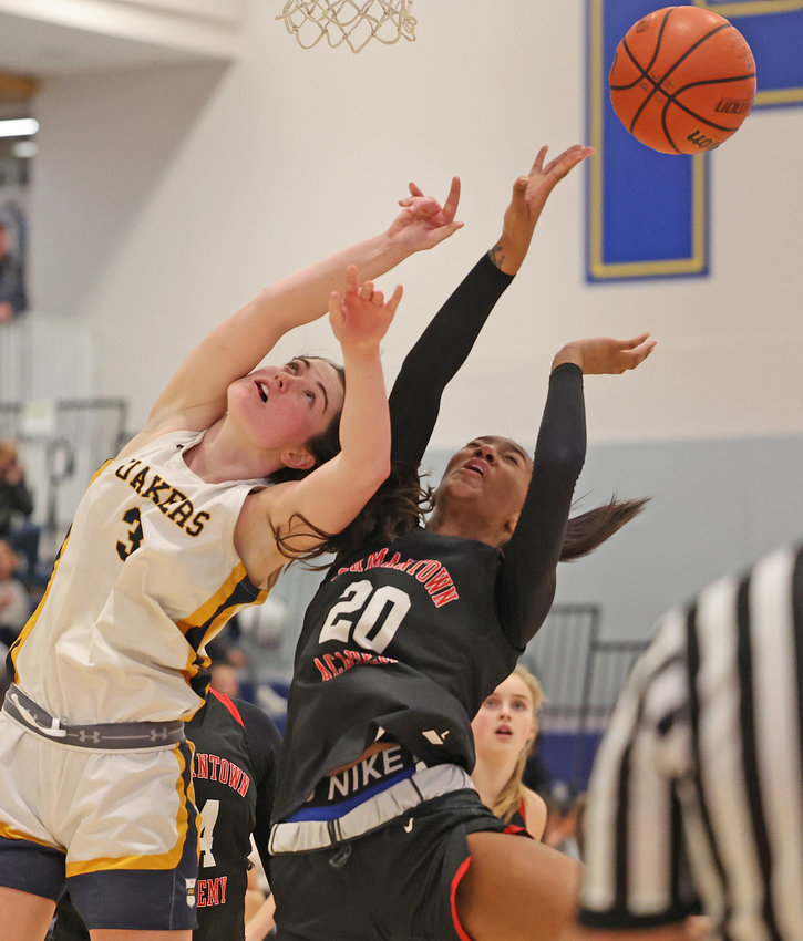 A pair of senior post players, PC's Bella Toomey (left) and GA's Kendall Bennett, go after a rebound.