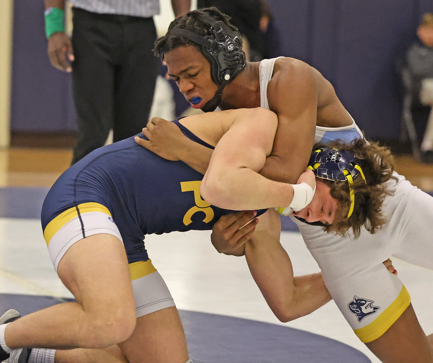 At 165 lbs. for SCH, Nasir Yard (right) resists a takedown attempt by the Quakers' Jack Bowen.
