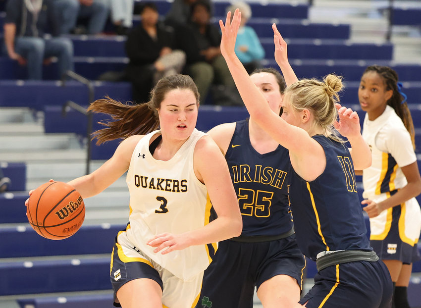 Penn Charter's Bella Toomey (with ball) drives the baseline against Notre Dame's Halligan sisters, Katie (center) and Lizzie (right).