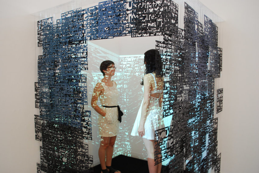 Kristine Heiney (left) and Dawn Kramlich stand inside of Kramlich's installation, &quot;A Solipsist's Cell,&quot; at Moore College of Art &amp; Design, where Kramlich earned an MFA.